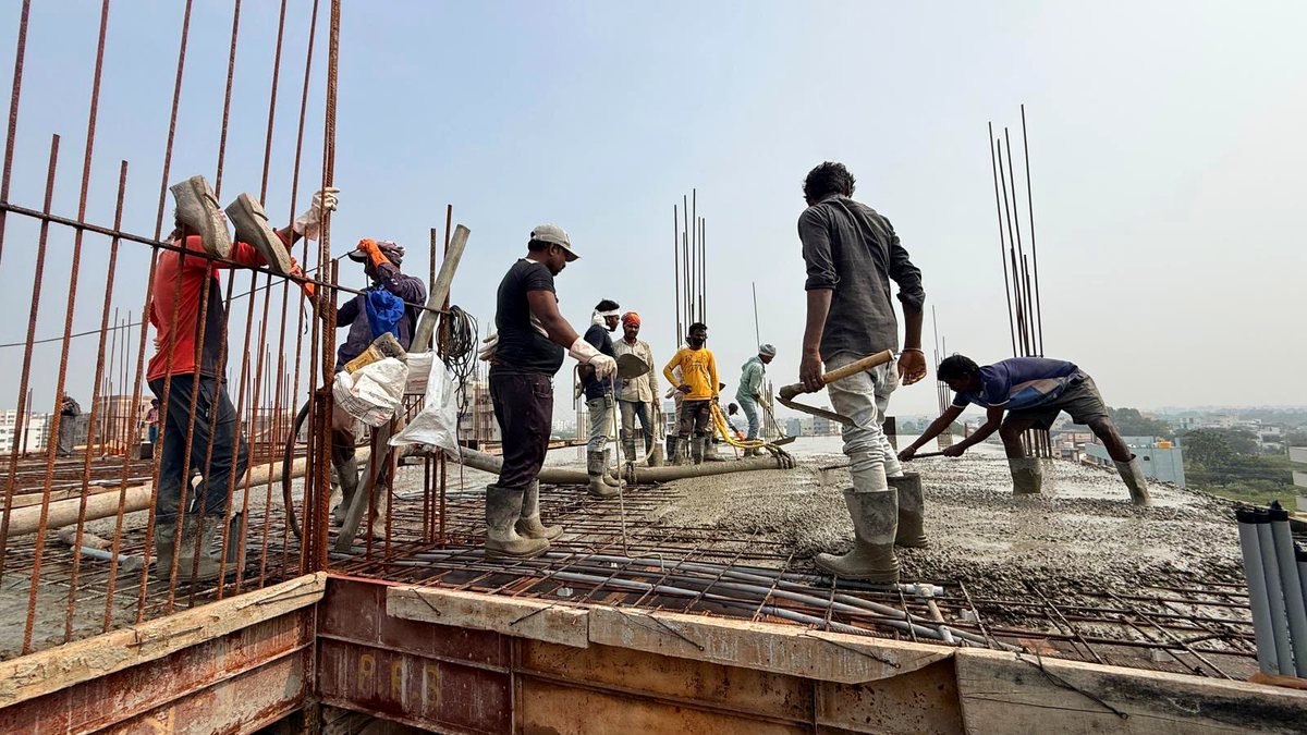 Sai Alekya crew placing and levelling a concrete slab at Alekya Homes